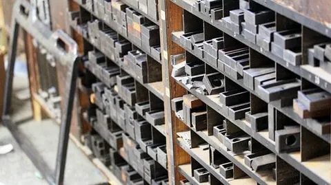 Rows of metal printing pieces stored in divided compartments