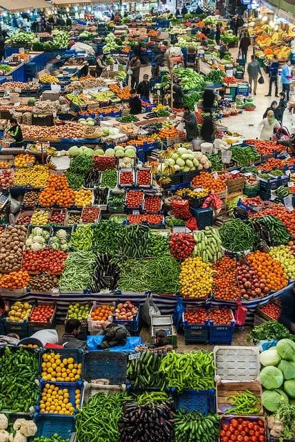 An overhead view of many colourful fruit and vegetable stalls