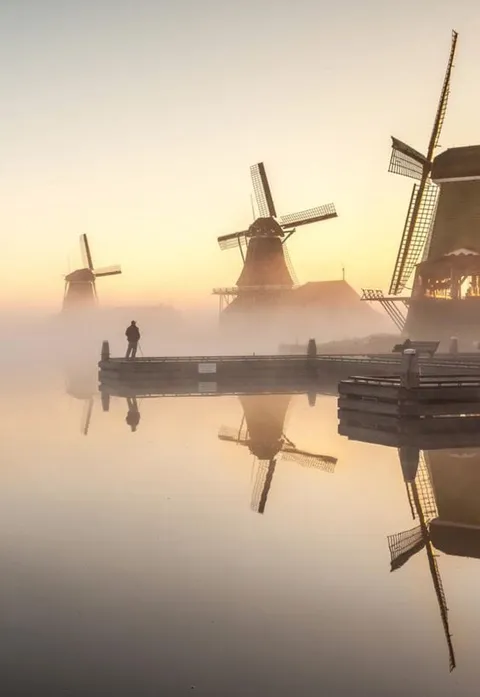 windmills in the fog